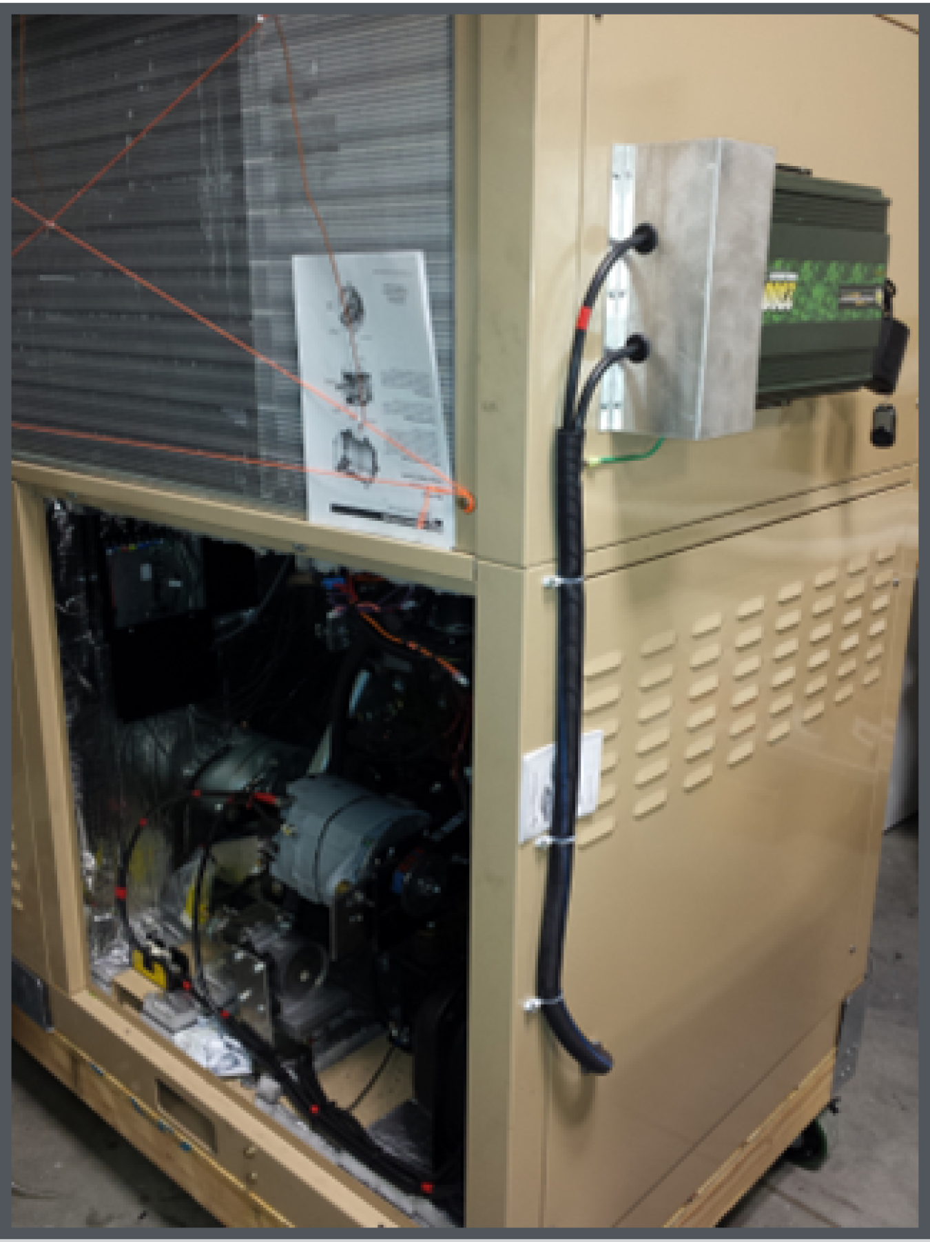 Photo of a Multi-Function Fuel-Fired Heat Pump prototype showing generator for auxiliary system power.