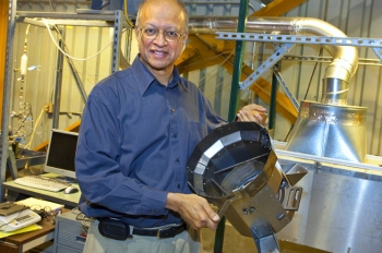 To reduce the amount of firewood Darfur refugees need, Berkeley Lab scientist Ashok Gadgil and colleagues modified an existing cookstove design to create one that is 75 percent more energy-efficient than the three-stone stove traditionally used in Darfur, and is appropriate to the environmental conditions and food preferences of the local inhabitants. | Photo courtesy of Lawrence Berkeley National Laboratory. To reduce the amount of firewood Darfur refugees need, Berkeley Lab scientist Ashok Gadgil and colleagues modified an existing cookstove design to create one that is 75 percent more energy-efficient than the three-stone stove traditionally used in Darfur, and is appropriate to the environmental conditions and food preferences of the local inhabitants. | Photo courtesy of Lawrence Berkeley National Laboratory.