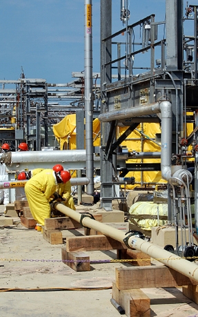 Savannah River Remediation employees work on the transfer line used to move grout to tanks 5 and 6. Savannah River Remediation employees work on the transfer line used to move grout to tanks 5 and 6.