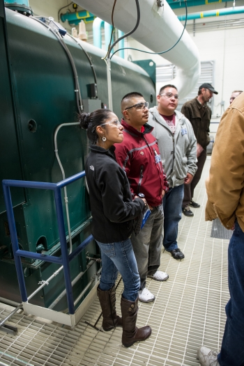 Touring NREL's Integrated Biorefinery Research Facility. From left to right: Reyna Banteah, Shaun Tsabetsaye, and Jeremy Laselute from the Zuni Pueblo Tribe. Photo by Dennis Schroeder, NREL Touring NREL's Integrated Biorefinery Research Facility. From left to right: Reyna Banteah, Shaun Tsabetsaye, and Jeremy Laselute from the Zuni Pueblo Tribe. Photo by Dennis Schroeder, NREL