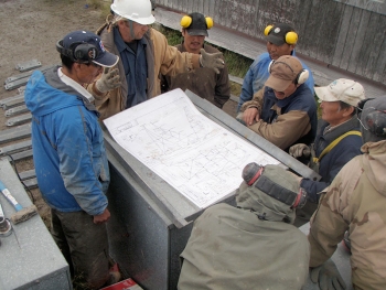 CWG community members review structural plans as part of their wind turbine training in Kwigillingok, AK. Photo from Intelligent Energy Systems, NREL 29205 CWG community members review structural plans as part of their wind turbine training in Kwigillingok, AK. Photo from Intelligent Energy Systems, NREL 29205