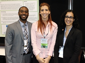DOE Fellows gather in front of the student poster created by DOE Fellow Michelle Embon, center, at the Waste Management 2014 Conference. DOE Fellows gather in front of the student poster created by DOE Fellow Michelle Embon, center, at the Waste Management 2014 Conference.