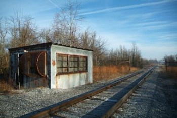 This railroad scale house, in West Kentucky Wildlife Management Area east of the Paducah site, was used
in the 1950s to weigh Paducah Gaseous Diffusion Plant freight. Workers preserved the old scale because of its potential historical significance. The scale house was demolished. This railroad scale house, in West Kentucky Wildlife Management Area east of the Paducah site, was used
in the 1950s to weigh Paducah Gaseous Diffusion Plant freight. Workers preserved the old scale because of its potential historical significance. The scale house was demolished.