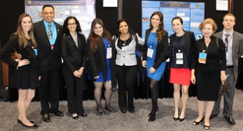 Pictured here are DOE Fellows with Florida International University Applied Research Center staff, including Dr. Leonel E. Lagos, second from left, and Dr. Yelena Katsenovich, second from right, at the Waste Management 2014 Conference Student Poster Competition. Pictured here are DOE Fellows with Florida International University Applied Research Center staff, including Dr. Leonel E. Lagos, second from left, and Dr. Yelena Katsenovich, second from right, at the Waste Management 2014 Conference Student Poster Competition.