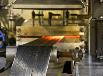 Oxidized fibers move to a high temperature furnace, where material is converted into carbon fiber at Oak Ridge National Laboratory's Carbon Fiber Technology Facility (CFTC). The CFTC enables companies to test low-cost carbon fiber for use in several industries including the clean energy sector. | Photo courtesy of Oak Ridge National Laboratory Oxidized fibers move to a high temperature furnace, where material is converted into carbon fiber at Oak Ridge National Laboratory's Carbon Fiber Technology Facility (CFTC). The CFTC enables companies to test low-cost carbon fiber for use in several industries including the clean energy sector. | Photo courtesy of Oak Ridge National Laboratory