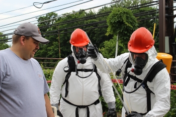 Trainer Randall Rickman, left to right, observes Larry Berg from EMâs Safety, Security and Quality Programs office and Tony Pierpoint from DOEâs Office of Independent Enterprise Assessments practice chemical sampling during Hazardous Waste Operations and Emergency Response initial training in Germantown, Md. Trainer Randall Rickman, left to right, observes Larry Berg from EMâs Safety, Security and Quality Programs office and Tony Pierpoint from DOEâs Office of Independent Enterprise Assessments practice chemical sampling during Hazardous Waste Operations and Emergency Response initial training in Germantown, Md.
