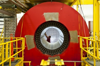 To explore the nucleus inside an atom, scientists use giant particle accelerators that act like microscopes. Detectors like this one collect the information for scientists to analyze. | Photo courtesy of Jefferson Lab. To explore the nucleus inside an atom, scientists use giant particle accelerators that act like microscopes. Detectors like this one collect the information for scientists to analyze. | Photo courtesy of Jefferson Lab.