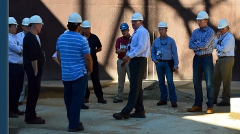 Ben Harp, center, manager of Hanfordâs Waste Treatment Plant Start-up and Commissioning Integration, discusses the advantages of ORP's Cold Test Facility to a group of congressional and state legislative staffers during a recent tour. Ben Harp, center, manager of Hanfordâs Waste Treatment Plant Start-up and Commissioning Integration, discusses the advantages of ORP's Cold Test Facility to a group of congressional and state legislative staffers during a recent tour.