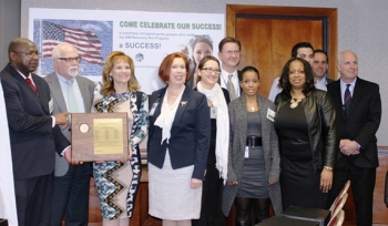 DOE employees gather for an award recognizing EM's Recovery Act Team. DOE employees gather for an award recognizing EM's Recovery Act Team.