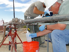 A specialist with the Nevada National Security Site groundwater characterization team collects a groundwater sample at well PM-3 located on the Nevada Test and Training Range, which is Air Force controlled land surrounding the NNSS. Groundwater characterization activities address the impacts of historic nuclear testing on groundwater. A specialist with the Nevada National Security Site groundwater characterization team collects a groundwater sample at well PM-3 located on the Nevada Test and Training Range, which is Air Force controlled land surrounding the NNSS. Groundwater characterization activities address the impacts of historic nuclear testing on groundwater.