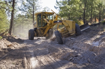 Remediation work in a Los Alamos canyon, photo from Los Alamos National Laboratory. Remediation work in a Los Alamos canyon, photo from Los Alamos National Laboratory.