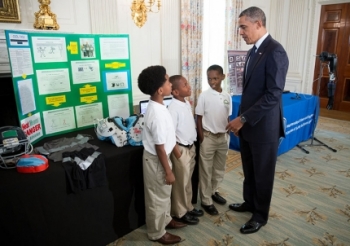 President Barack Obama talks with Evan Jackson, 10, Alec Jackson, 8, and Caleb Robinson, 8, from McDonough, Ga., while looking at exhibits at the White House Science Fair in the State Dining Room, April 22, 2013. The sports-loving grade-schoolers created a new product concept to keep athletes cool and helps players maintain safe body temperatures on the field. | Official White House Photo by Chuck Kennedy. President Barack Obama talks with Evan Jackson, 10, Alec Jackson, 8, and Caleb Robinson, 8, from McDonough, Ga., while looking at exhibits at the White House Science Fair in the State Dining Room, April 22, 2013. The sports-loving grade-schoolers created a new product concept to keep athletes cool and helps players maintain safe body temperatures on the field. | Official White House Photo by Chuck Kennedy.