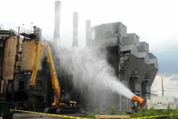 A high-pressure water cannon is used to control dust for the demolition of the X-600 Steam Plant. A high-pressure water cannon is used to control dust for the demolition of the X-600 Steam Plant.