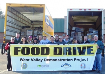 Volunteers from West Valley Demonstration Project gather before distributing items collected in an annual food drive. Volunteers from West Valley Demonstration Project gather before distributing items collected in an annual food drive.