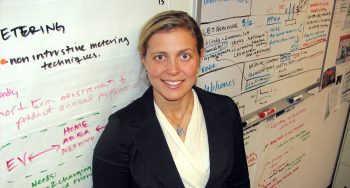 PNNL Lab Homes researchers Sarah Widder stands in front of the âbrainstorming boardâ in her office. Many of these ideas have been generated by utilities, other researchers and the public as part of a workshop PNNL held during the ribbon-cutting ceremony for the Lab Homes two years ago. To submit your ideas on the technologies researchers should test, visit <a href="http://labhomes.pnnl.gov/">labhomes.pnnl.gov</a>. | Photo courtesy of Kristin Nolan. PNNL Lab Homes researchers Sarah Widder stands in front of the âbrainstorming boardâ in her office. Many of these ideas have been generated by utilities, other researchers and the public as part of a workshop PNNL held during the ribbon-cutting ceremony for the Lab Homes two years ago. To submit your ideas on the technologies researchers should test, visit <a href="http://labhomes.pnnl.gov/">labhomes.pnnl.gov</a>. | Photo courtesy of Kristin Nolan.