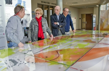 Steve Hampson of the University of Kentucky, left to right, West Kentucky Community & Technical College President Dr. Barbara Veazey, Paducah Junior College Board of Trustees member Ken Wheeler and Buz Smith of the DOE Paducah Site Office examine a DOE Paducah Site groundwater model exhibit at the West Kentucky Community & Technical College Emerging Technology Center. Steve Hampson of the University of Kentucky, left to right, West Kentucky Community & Technical College President Dr. Barbara Veazey, Paducah Junior College Board of Trustees member Ken Wheeler and Buz Smith of the DOE Paducah Site Office examine a DOE Paducah Site groundwater model exhibit at the West Kentucky Community & Technical College Emerging Technology Center.