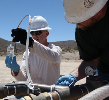 Field personnel collect groundwater samples at a well in Yucca Flat as part of the NNSS groundwater characterization program. Though contamination from underground testing has never been detected on public land, DOE is committed to developing an advanced, reliable monitoring network that ensures the long-term protection of the public. Risks associated with contamination remain low due to the immobility of some contaminants and the extremely slow movement of others. Field personnel collect groundwater samples at a well in Yucca Flat as part of the NNSS groundwater characterization program. Though contamination from underground testing has never been detected on public land, DOE is committed to developing an advanced, reliable monitoring network that ensures the long-term protection of the public. Risks associated with contamination remain low due to the immobility of some contaminants and the extremely slow movement of others.
