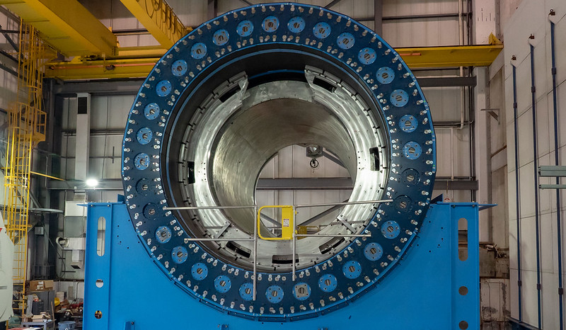 Large, blue, circular PHENIX addition to the Relativist Heavy Ion Collider (RHIC).