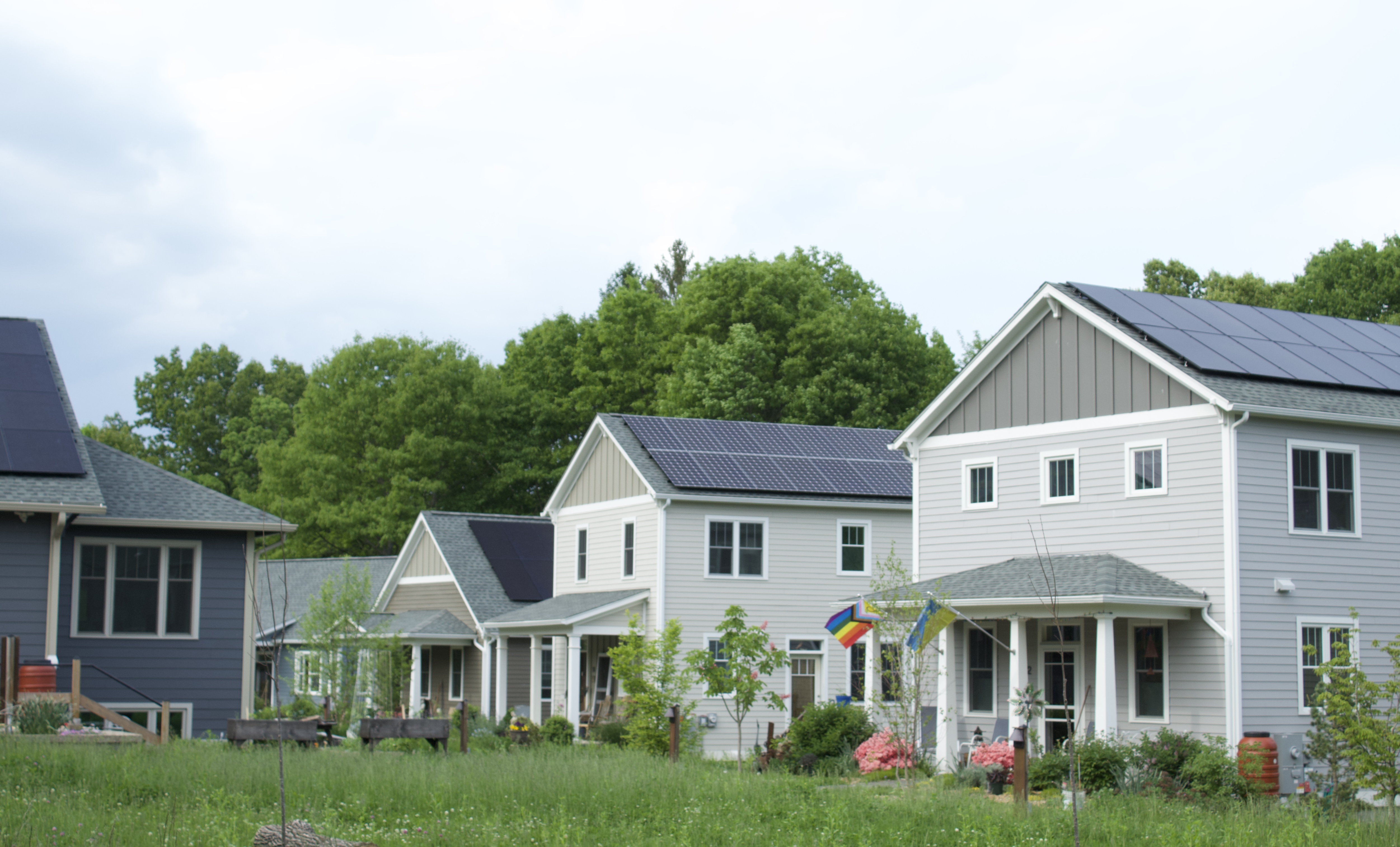 Different types of solar panels installed on all the roofs of a new residential community in rural Massachusetts.