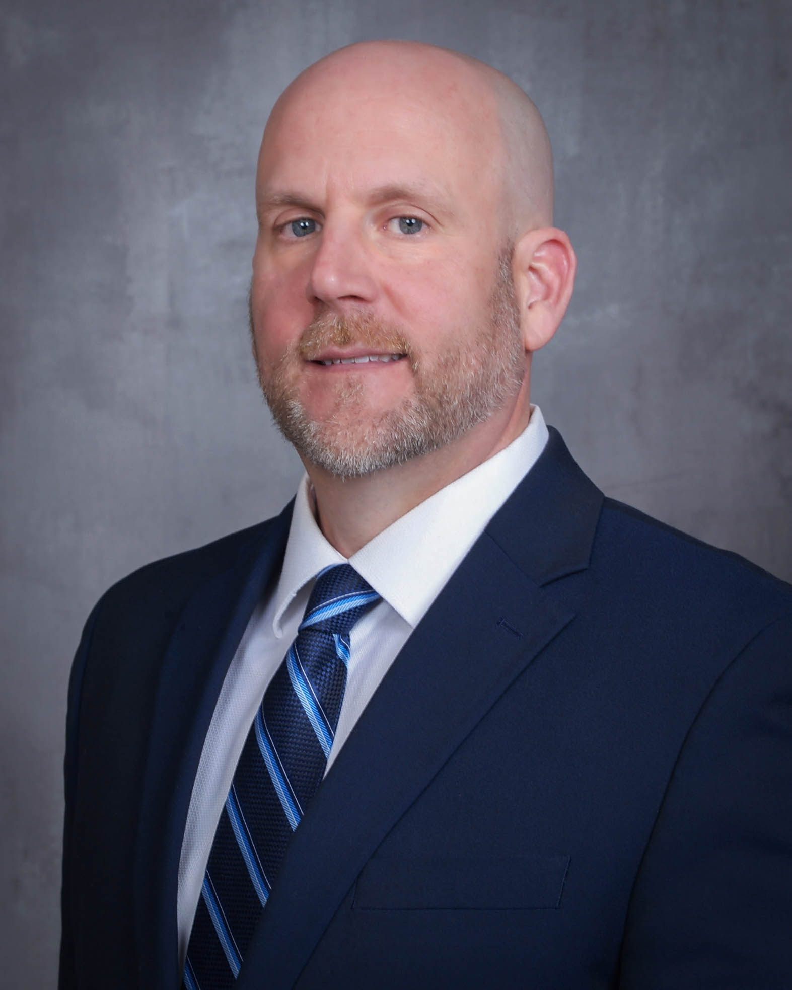 Jeffrey T. Williams wearing a blue suit