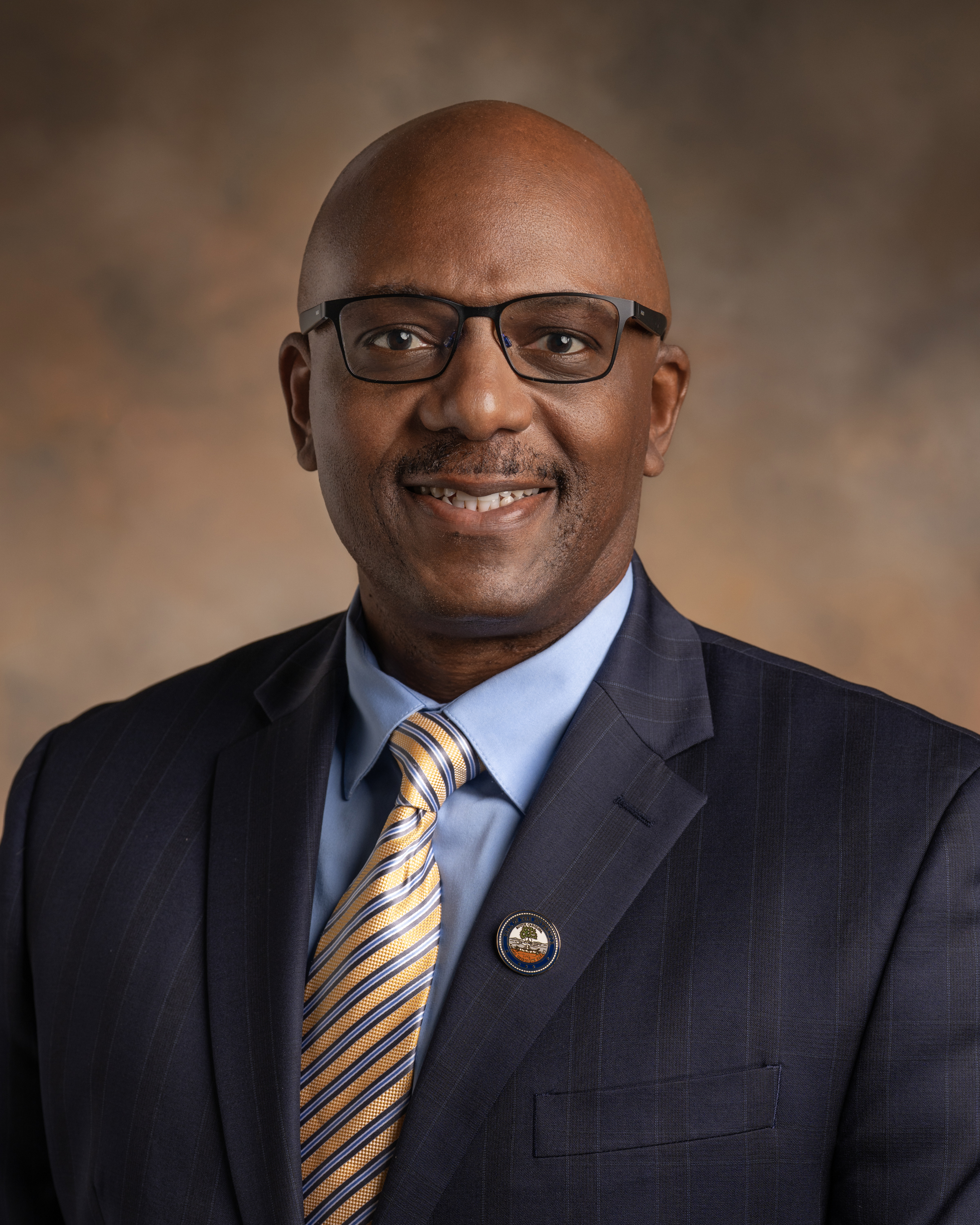 Portrait of a man in glasses and a suit