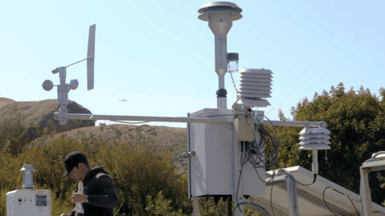 Rotating set of images of air monitoring devices placed around the ETEC Site