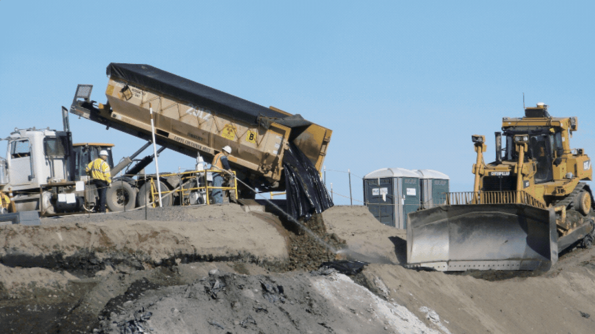 Rotating set of images of cleanup being carried out by workers and construction vehicles at the Hanford Site