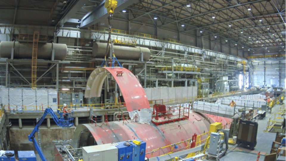 Rotating set of images of a demolition occurring inside a facility building 