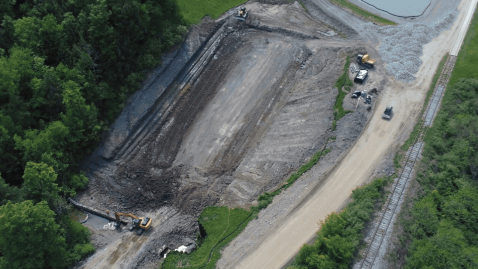 Rotating set of images of a spillway being rebuilt at the West Valley Demonstration Project