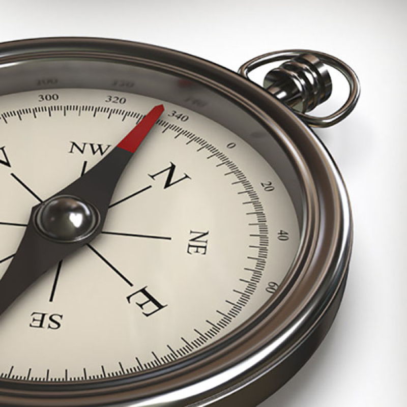 Up close photo of a compass.