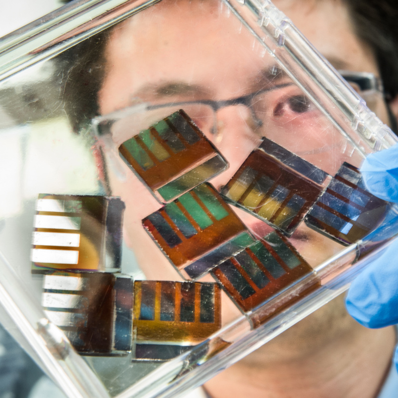 NREL researcher, Mengjin Yang, works with hybrid perovskite solar cells in his lab at the National Renewable Energy Laboratory (NREL). 
