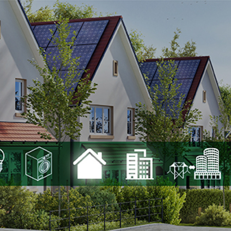 a row of tract houses with identical solar panels on their roofs