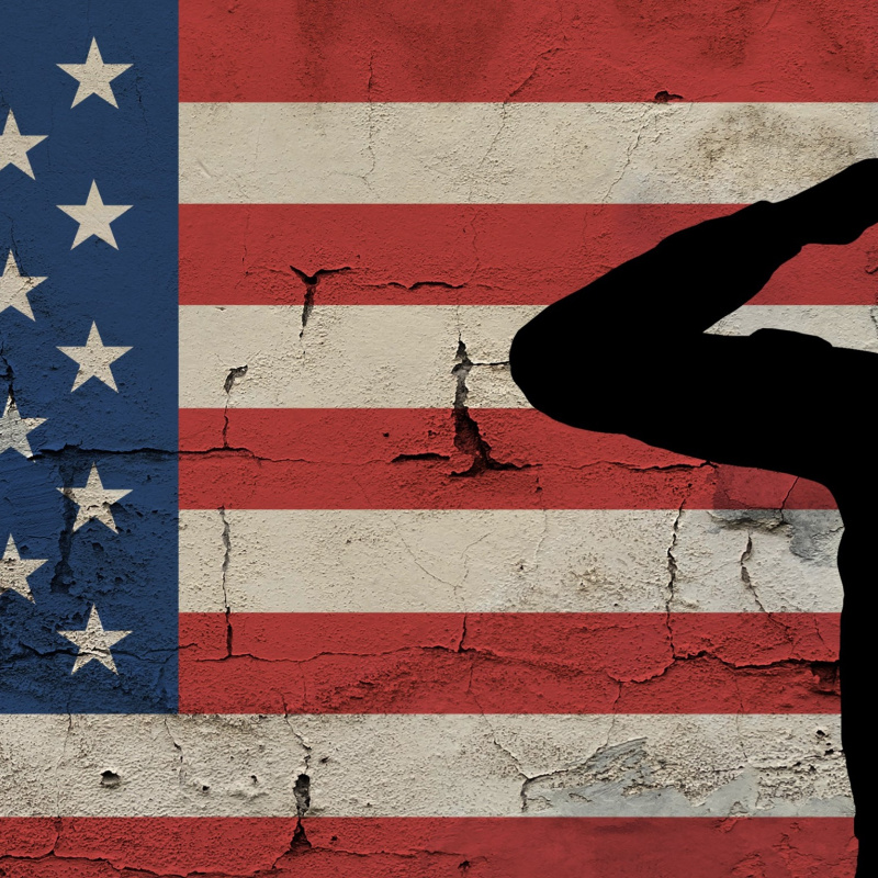 Veteran in front of an American flag