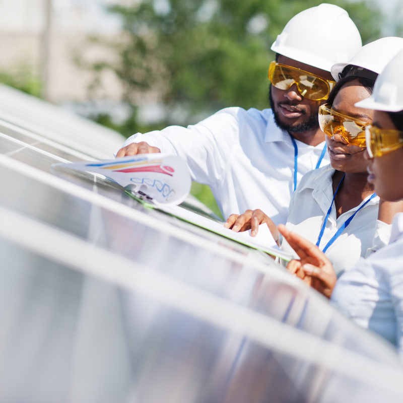 Workers installing solar panel