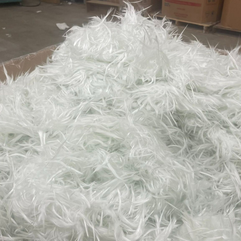 A large amount of recycled glass fiber placed in a cardboard box.