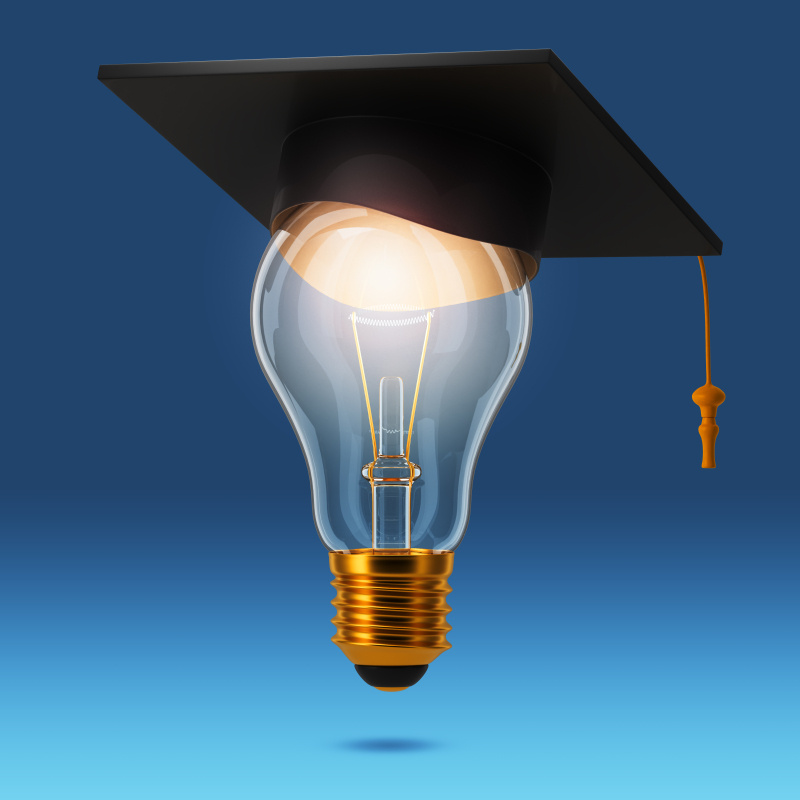 A lightbulb with a graduation cap on top of it.