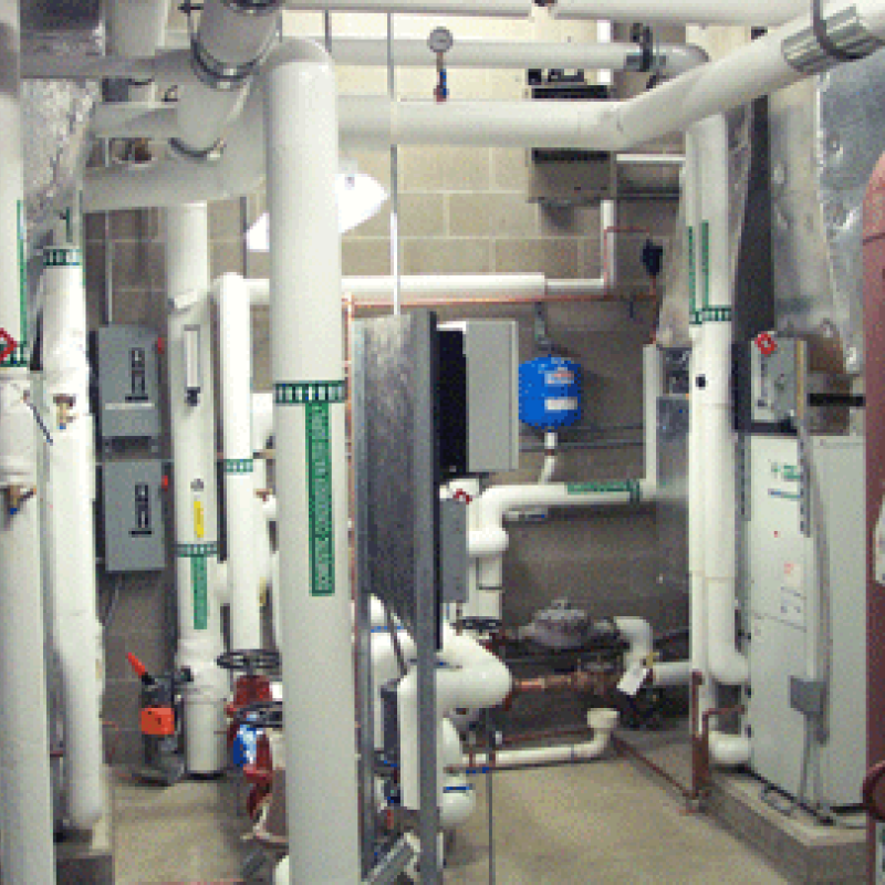 Geothermal heating and cooling system for a building.