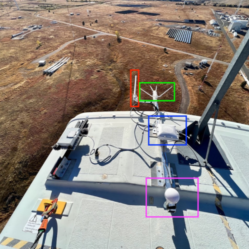 Devices attached to the top of a wind turbine as viewed from on top of that turbine.