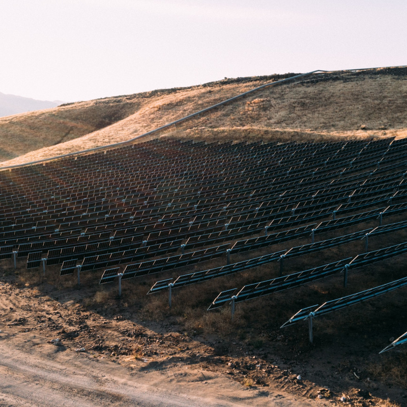 Photo of an 11-megawatt solar array equipped with Nevados trackers on sloped ground in Reno, Nevada