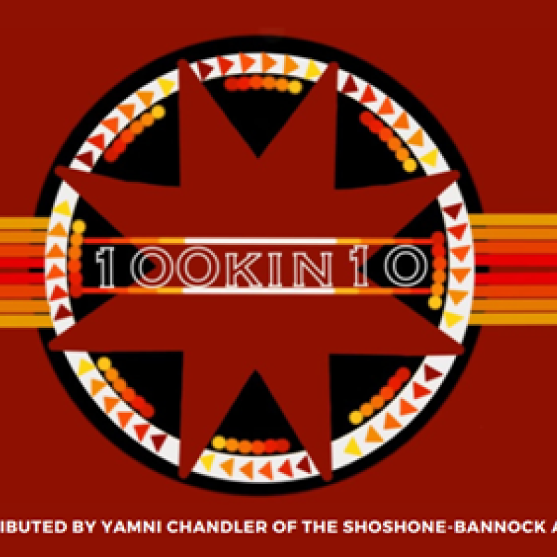 red, black, yellow, and orange artwork. 8 point star inside a circle with horizontal lines on either side of the circle. "100Kin10" written inside the star. Attribution text is listed at the bottom: Artwork contributed by Yamni Chandler of the Shoshone-Bannock and Lakota Sioux
