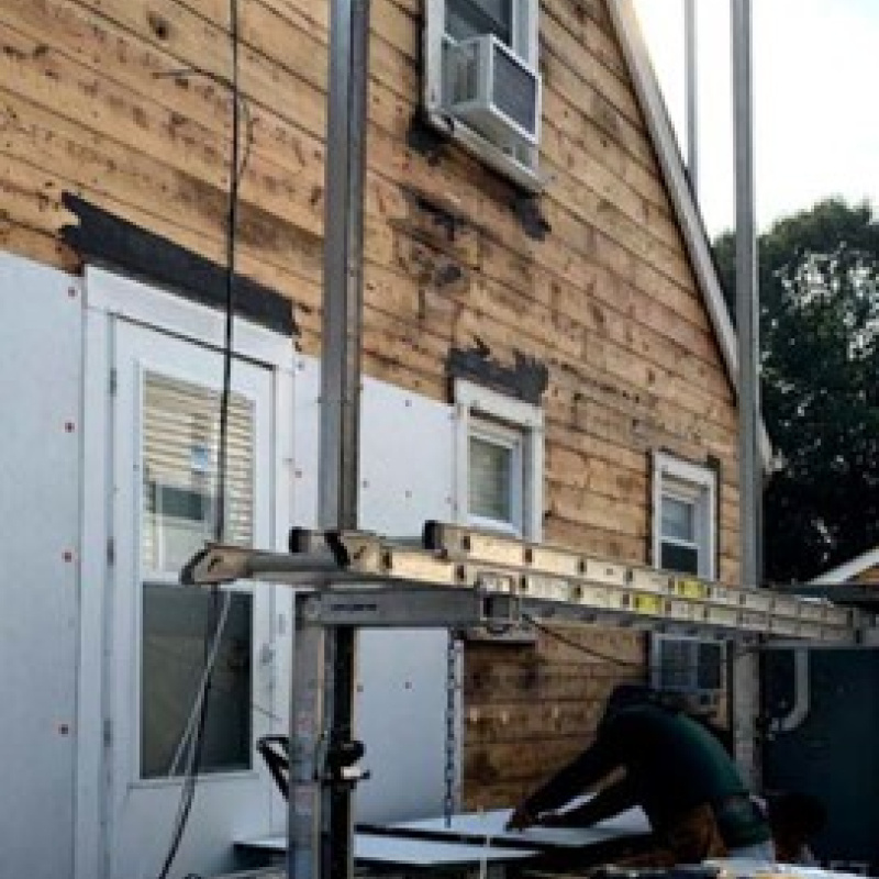 The side of a house getting re-sided