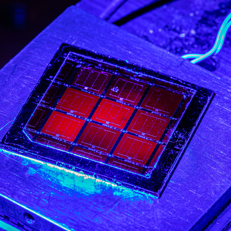 Solar cells on a slide illuminated by blue light 