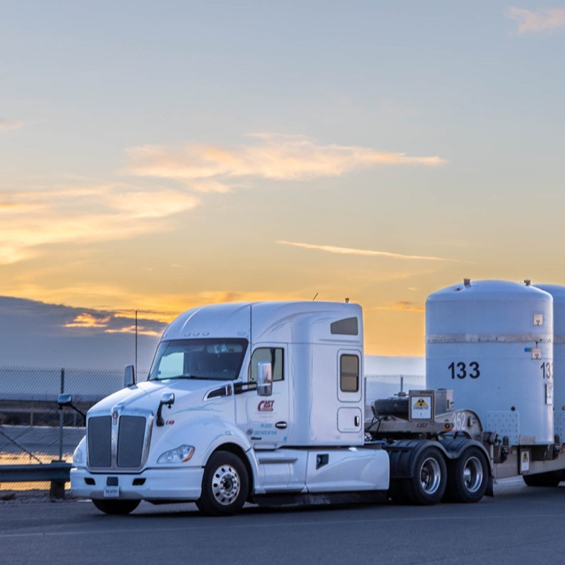 A large truck carrying three large shipping containers. 