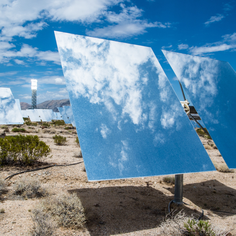 Heliostat mirror reflects sky and clouds