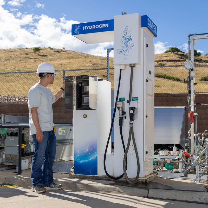 Intern monitoring the Hydrogen Refueling Dispenser at the Hydrogen Infrastructure Testing and Research Facility.