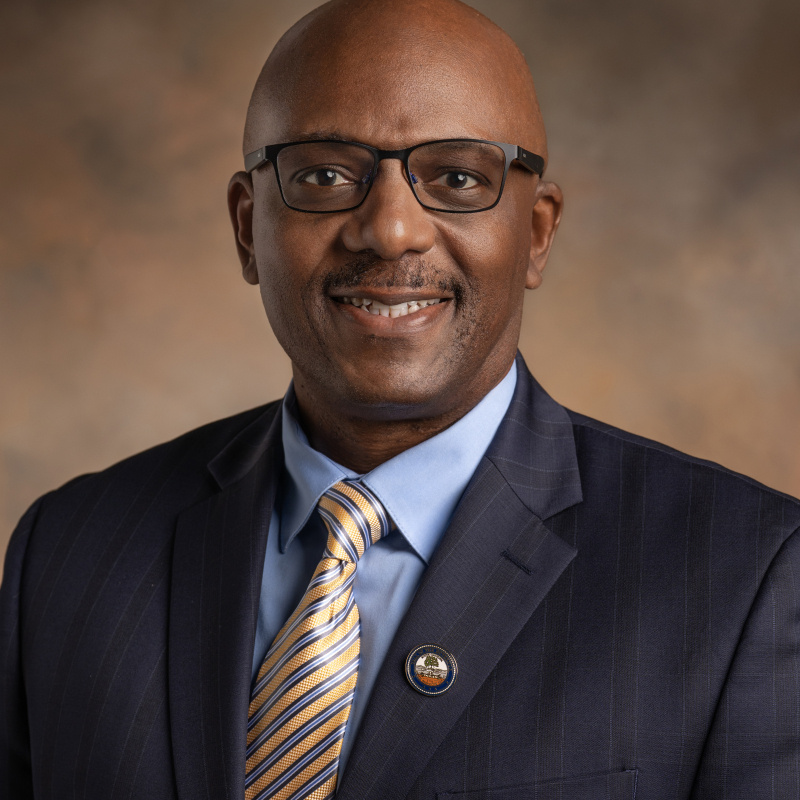 Portrait of a man in glasses and a suit