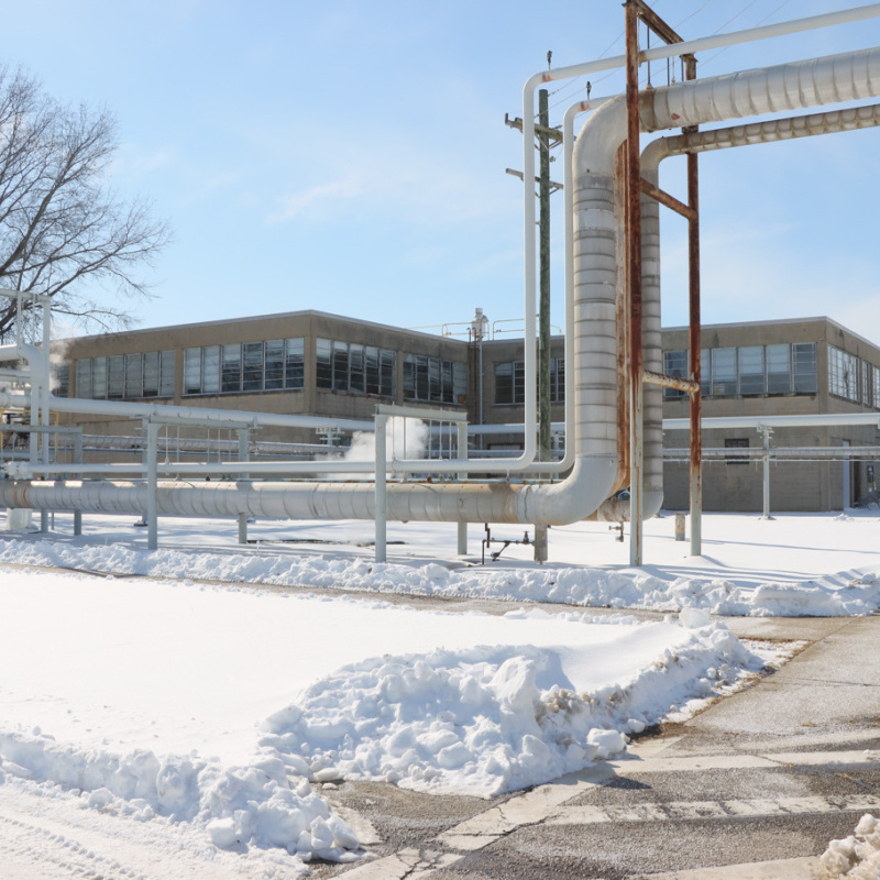 The outside of a large facility building at the Portsmouth Site with snow on the ground