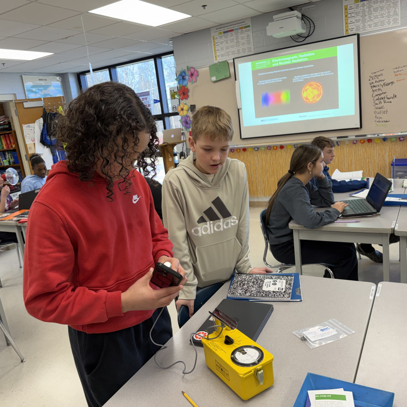Two students working on STEM activities in a classroom