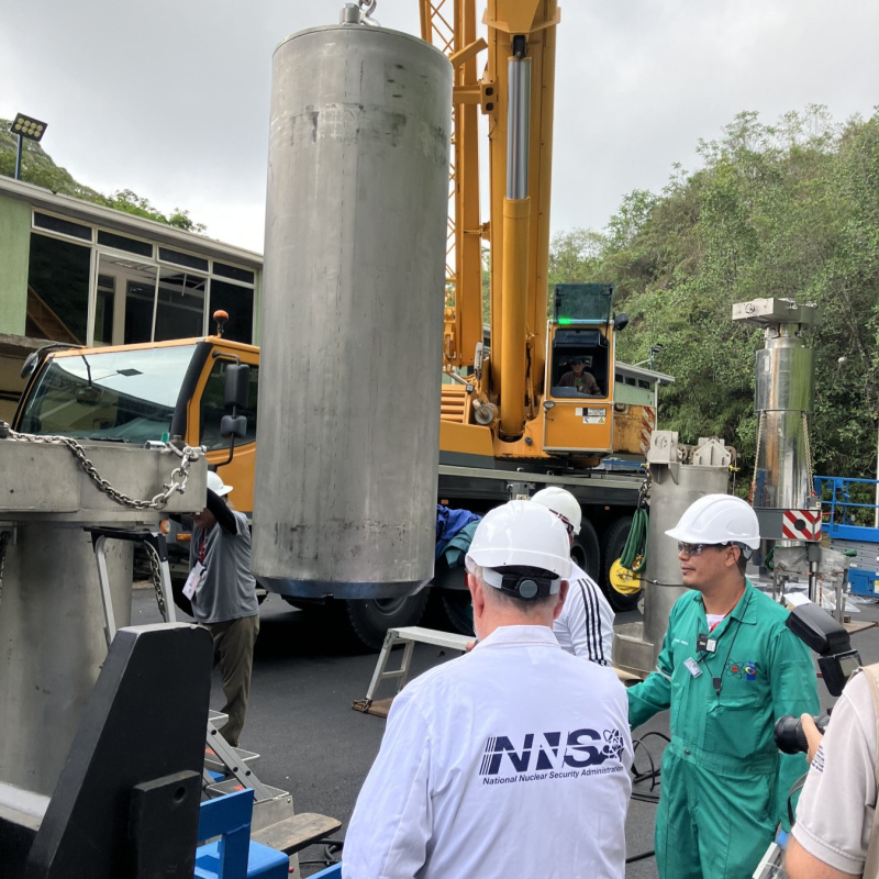NNSA technical experts overseeing the loading of nuclear fuel into the specialized spent nuclear fuel cask during the removal of highly enriched uranium from Venezuela.