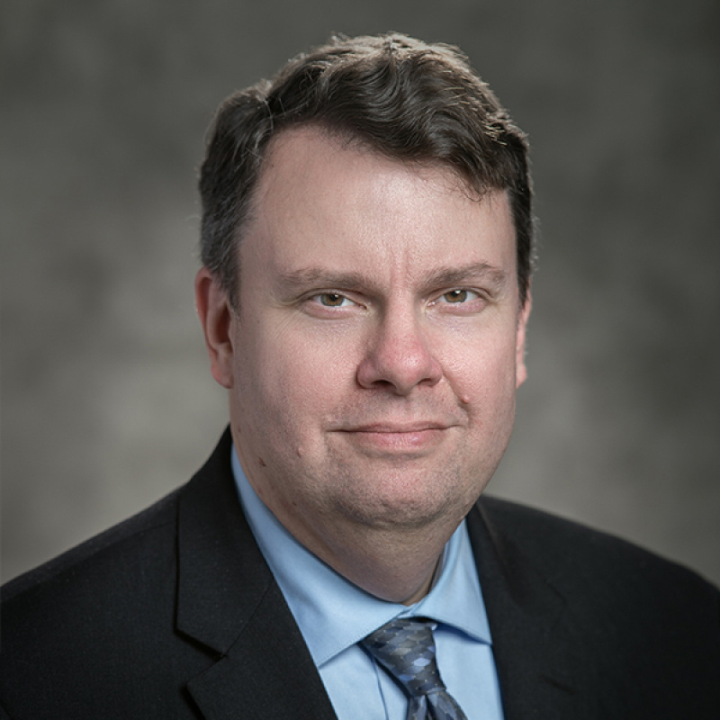Cropped photo of Christopher Johns, Deputy Chief Financial Officer 
